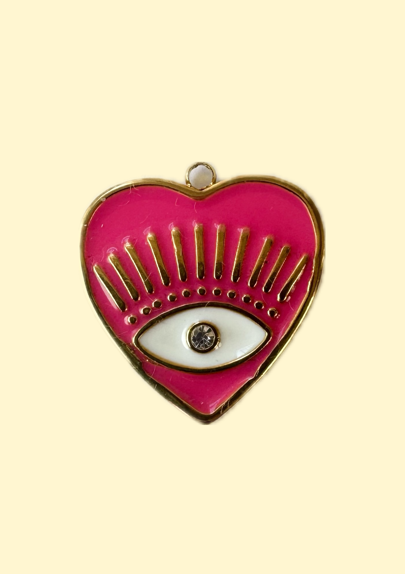Charms oeil coeur fuchsia